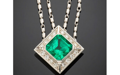White gold double chain necklace with a ct. 7 circa octagonal emerald central accented with diamonds in all ct. 0.60...