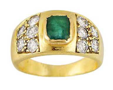 Yellow gold band ring set with emerald and...