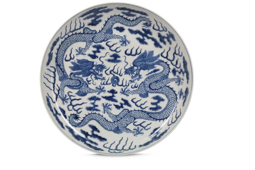 A CHINESE BLUE AND WHITE 'DRAGON' CHARGER. Qing Dynasty,...