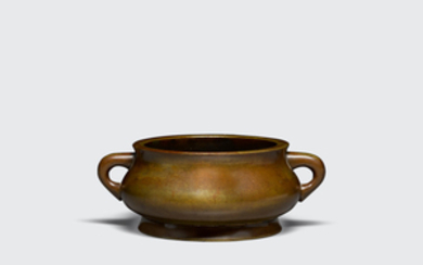 A cast bronze incense burner