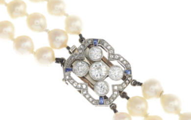 A cultured pearl three-row necklace, with mid 20th century platinum and gold, diamond and sapphire clasp.