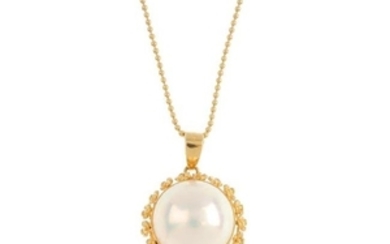 A mabe pearl pendant. The mabe pearl, with floral