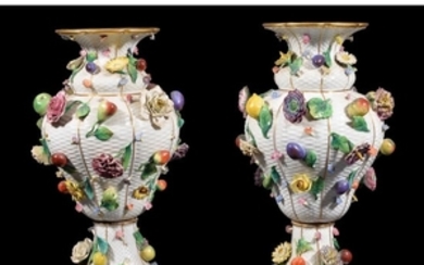A pair of Meissen (outside decorated) flower and fruit encrusted ozier-moulded baluster vases