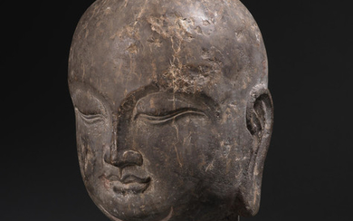 A rare carved black limestone head of a luohan
