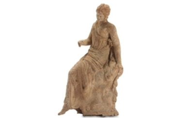 A TANGRA TERRACOTTA FEMALE FIGURE Circa 3rd Century...