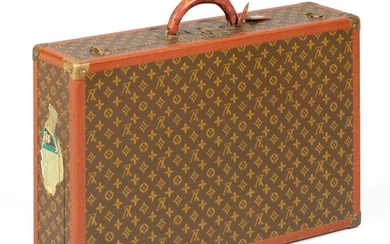 VINTAGE LOUIS VUITTON HARD-SIDED SUITCASE Exterior with allover LV monogram, leather handle, and brass hardware and lock. Label on i...