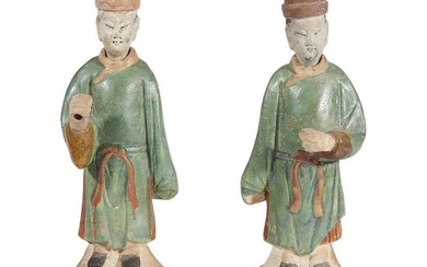 A pair of Chinese standing pottery figures, possibly