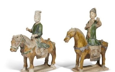 A pair of Chinese pottery horses and riders, possibly