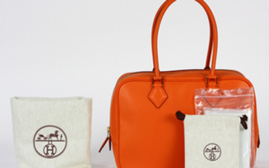 Hermes plume handbag, executed in orange, 28cm, retains dust bag, rain jacket, and original box, with Neiman Marcus receipt, marked...