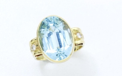 750 thousandths gold ring set with a faceted oval blue stone imitating aquamarine in a closed setting with brilliant diamonds. French work.