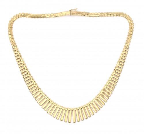A 14 karat gold fringe necklace. A graduated design composed of flat fringe and rectangular links to a tongue clasp. Gross weight: 40.8 g.