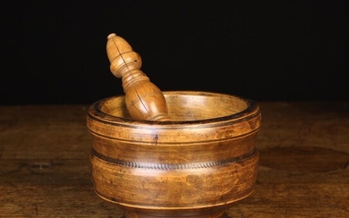 A 19th Century Turned Treen Pestle & Mortar. The decoratively turned pestle having an ovoid knopped