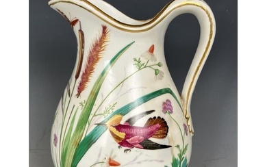A 19th century Coalport jug, decorated birds, handle restore...