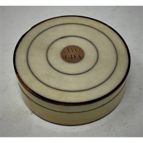 A 19th century tortoiseshell and ivory circular box and cove...