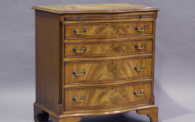 A 20th century reproduction mahogany serpentine fronted chest, fitted with a brushing slide, height