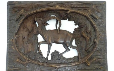 A 20thC Black Forest style carved wooden panel with