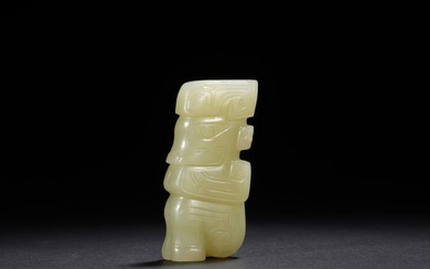 A CHINESE CELADON JADE SEATED FIGURE