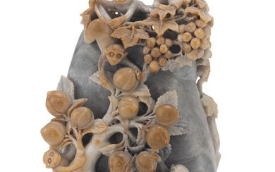 A CHINESE SOAPSTONE GROUP DEPICTING A ROCK WITH MONKEYS. 20TH CENTURY.