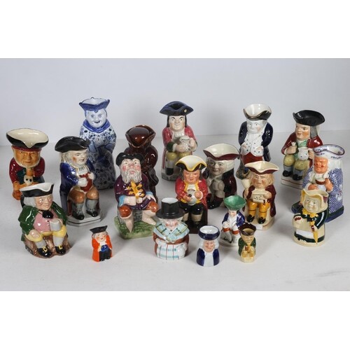 A COLLECTION OF NINTEEN TOBY JUGS to include a wood potters ...