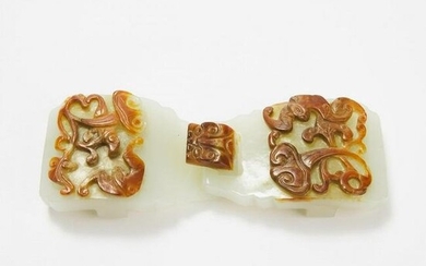 A Carved and Pierced White and Russet Jade Belt Buckle