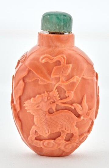 A Chinese Carved Coral Snuff Bottle