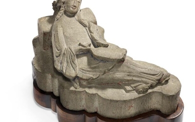 SOLD. A Chinese carved limestone scroll weight of a reposing woman, remains of paint. Qianlong 1736-1795. L. 21 cm. Fitted hardwood base included. – Bruun Rasmussen Auctioneers of Fine Art