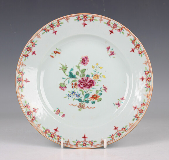 A Chinese famille rose export porcelain plate, Qianlong period, painted with a central tied flower s