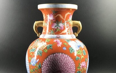 A Chinese famille rose with elephant handles porcelain vase....