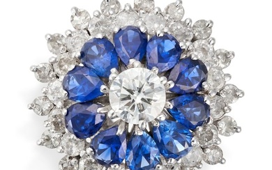 A DIAMOND AND SAPPHIRE CLUSTER RING in 18ct white gold, set to the centre with a round brilliant cut