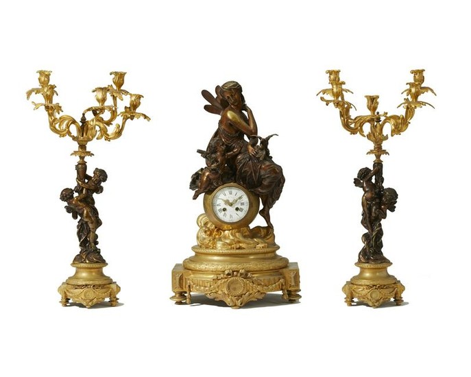 A French gilt and patinated bronze clock and garniture