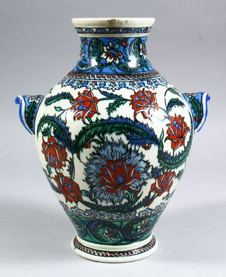 A GOOD EARLY IZNIC POTTERY VASE decorated with flora