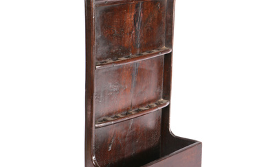 A George III oak spoon rack, circa 1790 Having a one-piece backboard with cyma-recta moulded flat