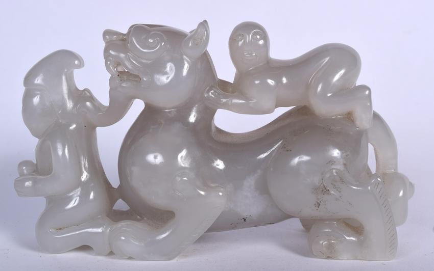 A LARGE CHINESE JADE CARVING OF A MYTHICAL BEAST