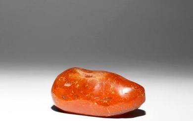 A LARGE PIECE OF AMBER PREHISTORIC Naturalistically formed, the fossilized...
