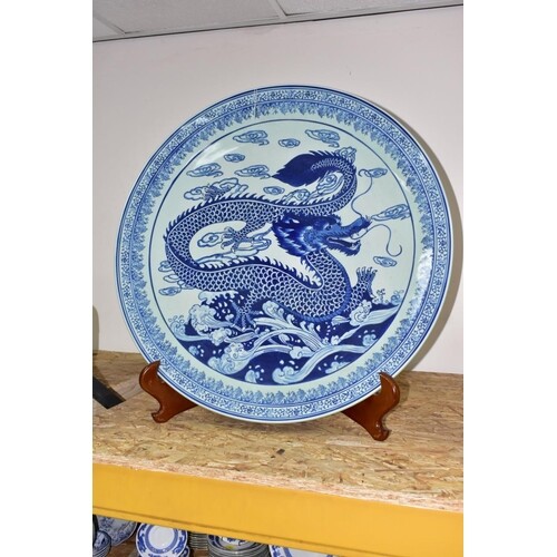 A LATE 20TH CENTURY JAPANESE BLUE AND WHITE CHARGER, printed...