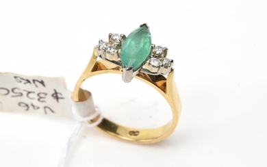 A MARQUISE EMERALD AND DIAMOND DRESS RING IN 14CT GOLD, SIZE O