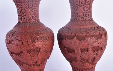 A PAIR OF 19TH CENTURY CHINESE CARVED CINNABAR LACQUER VASES Qing, decorated with figures in landsca