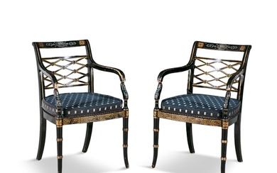 A PAIR OF EDWARDIAN EBONISED AND PARCEL GILT ARMCHAIRS, ea...