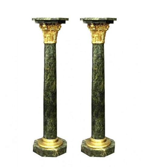 A PAIR OF FRENCH ORMOLU MOUNTED MARBLE PEDESTALS
