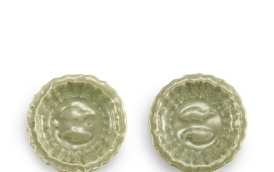 A PAIR OF MOULDED LONGQUAN CELADON 'TWIN FISH' BARBED DISHES YUAN DYNASTY | 元 龍泉青釉雙魚折沿菱口盤一對