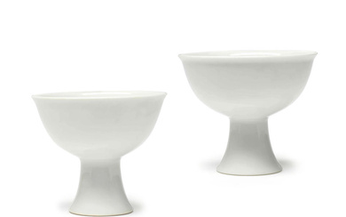 A PAIR OF WHITE-GLAZED 'PHOENIX' STEM CUPS Yongle four-character marks,...