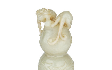 A PALE CELADON JADE 'CHILONG AND DOUBLE GOURD' CARVING 18th...