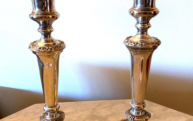 A Pair of Silver Plate Candlesticks with Floral Repousse Detail