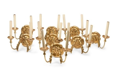 A Set of Eight Continental Giltwood Three-Light Sconces