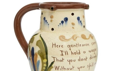 A Torquay motto puzzle jug, inscribed with...