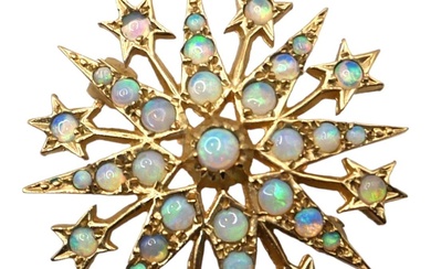 A VINTAGE 9CT GOLD AND OPAL STAR BROOCH Having...