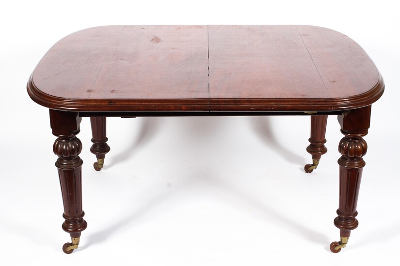 A Victorian mahogany dining table, with moulded rectangular top