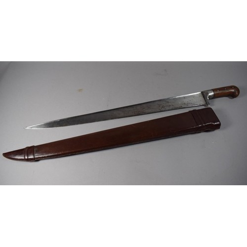 A Vintage Wooden Handled Machete with Leather Scabbard, Blad...