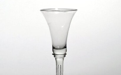 A balustroid wine glass c.1740, the slender bell bowl raised...