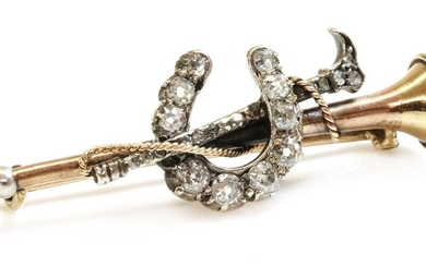 A cased diamond set hunting horn, horseshoe and crop bar brooch, c.1900